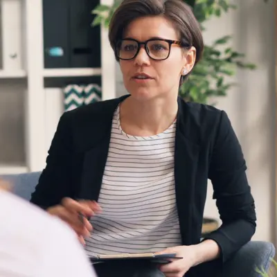A woman face on speaking to another person