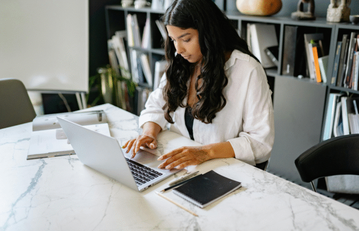 woman at her desk creating an editorial calendar