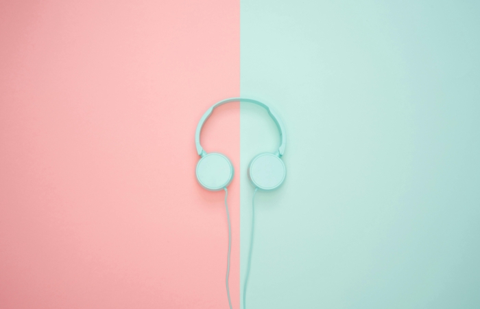 Turquoise headphones on a colourful background